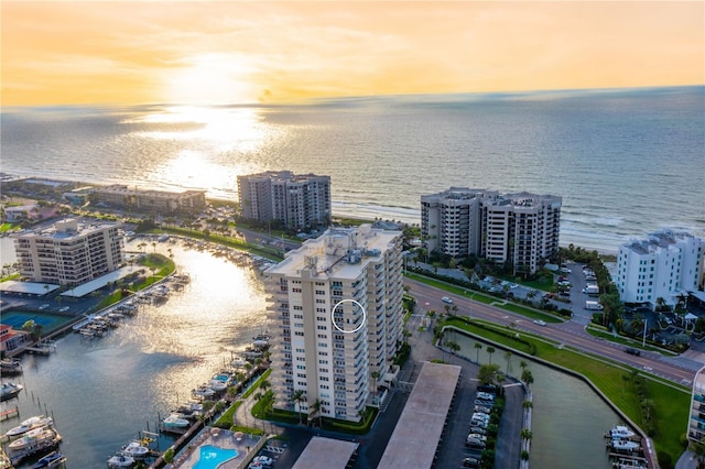 aerial view at dusk with a water view