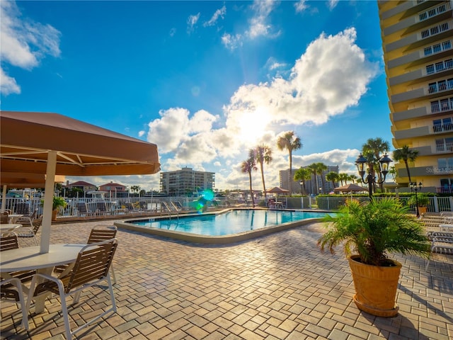 view of swimming pool featuring a patio area