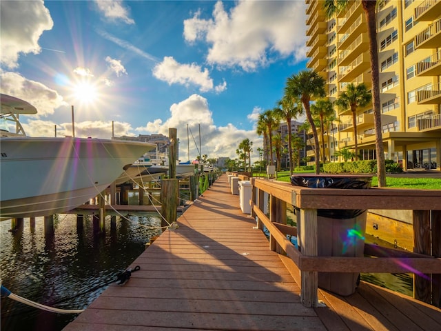 view of dock featuring a water view and a balcony