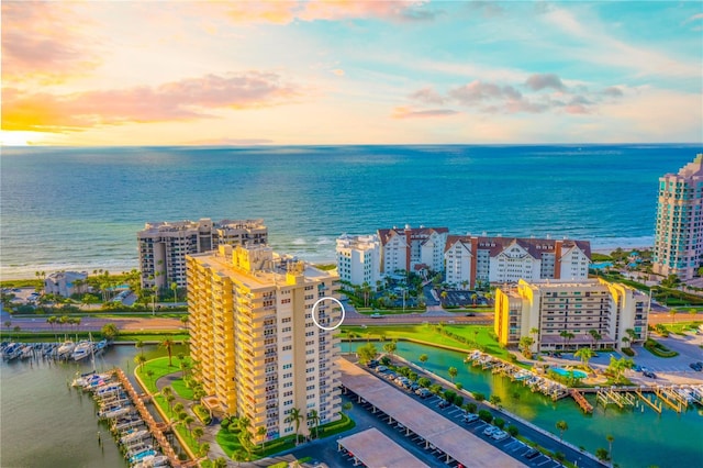 aerial view at dusk with a water view