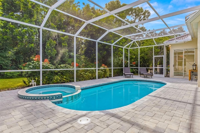 view of swimming pool with a patio area, an in ground hot tub, and glass enclosure