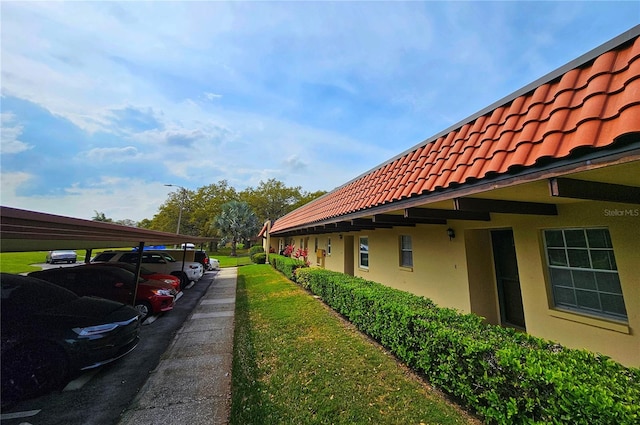 exterior space with a carport