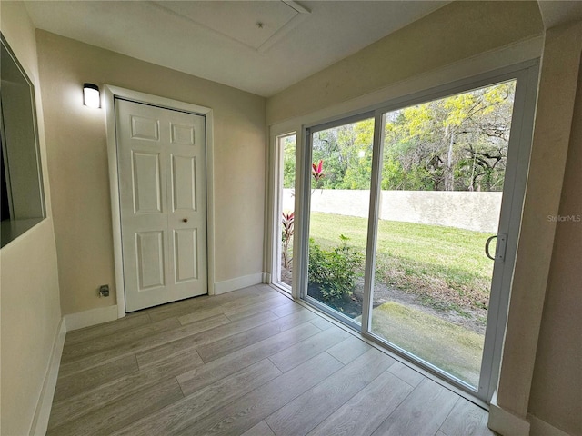 entryway with light hardwood / wood-style floors