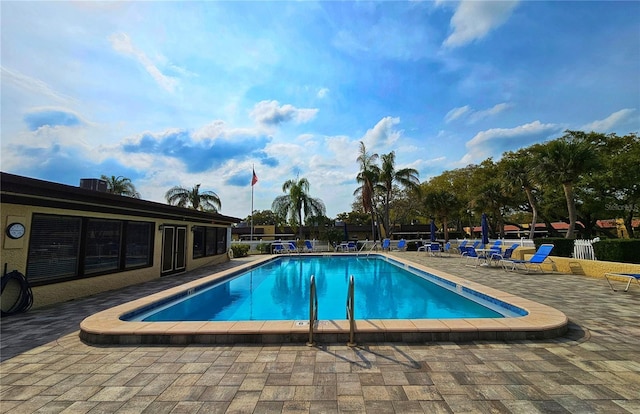 view of swimming pool featuring a patio