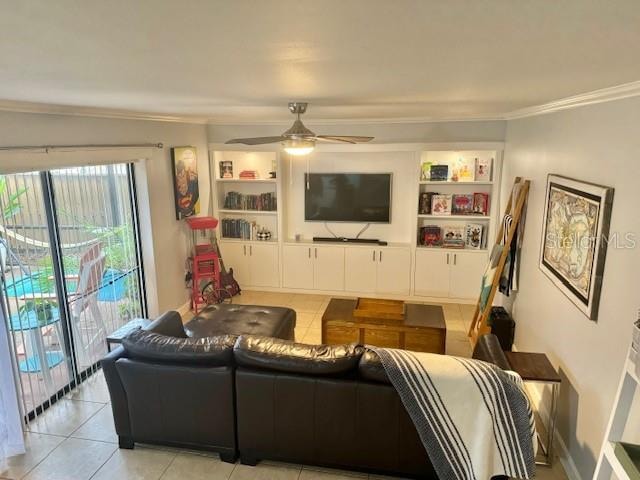 tiled living room with ornamental molding, ceiling fan, and built in features