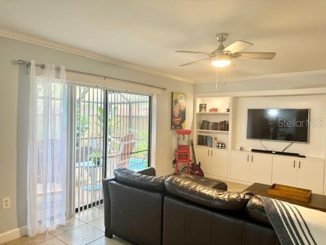 living room with crown molding, ceiling fan, and light tile flooring