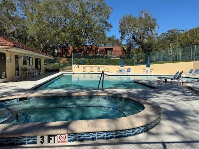 view of swimming pool with a patio