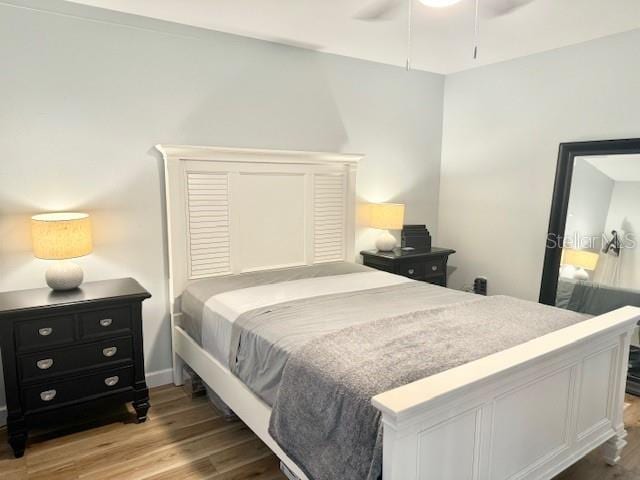 bedroom featuring light hardwood / wood-style floors and ceiling fan