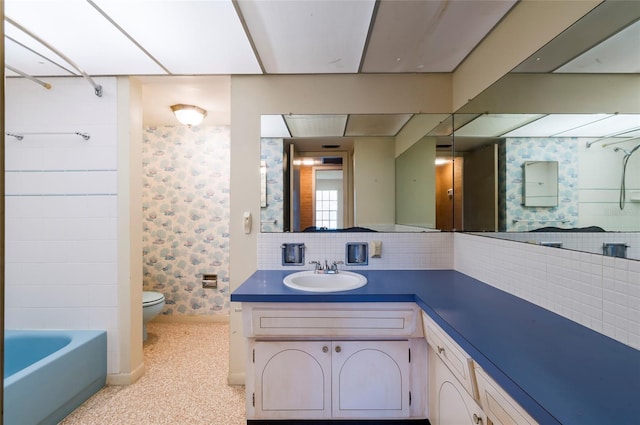 full bathroom featuring shower / bathtub combination, backsplash, toilet, and vanity