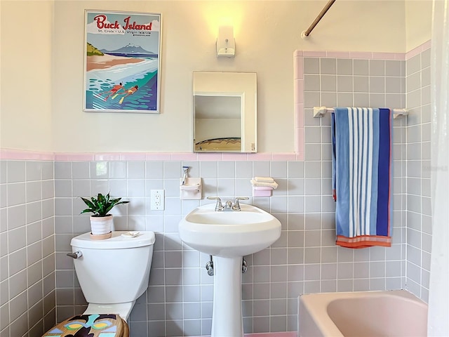 bathroom with tile walls, shower / bathing tub combination, toilet, and tasteful backsplash