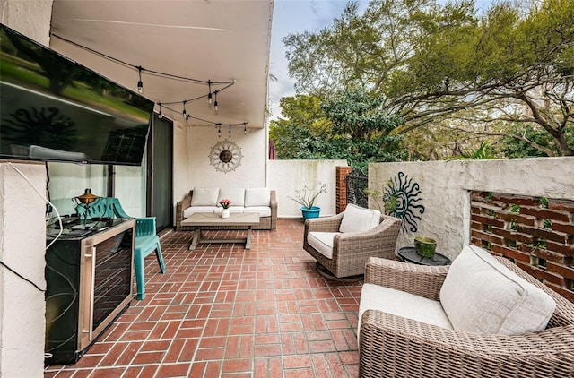 view of patio with beverage cooler