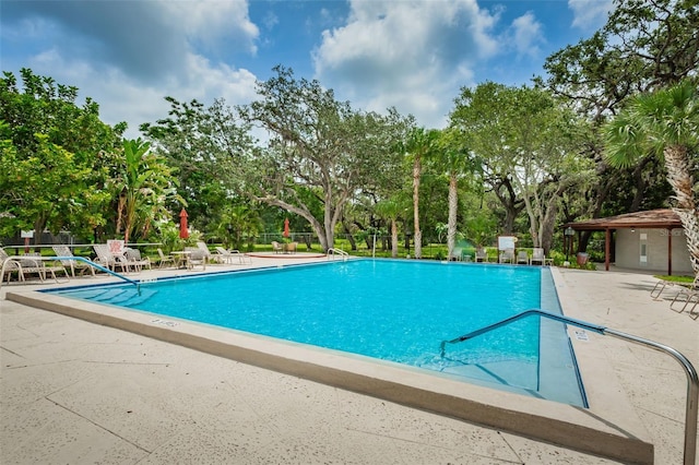 view of swimming pool with a patio area