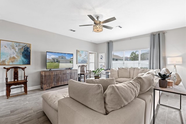 living room with ceiling fan