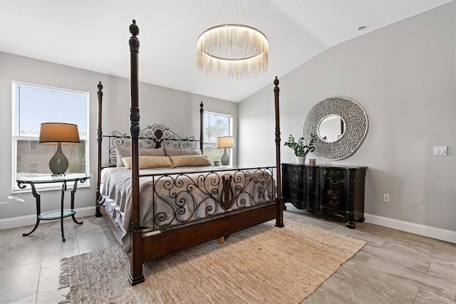 bedroom with vaulted ceiling and light tile floors