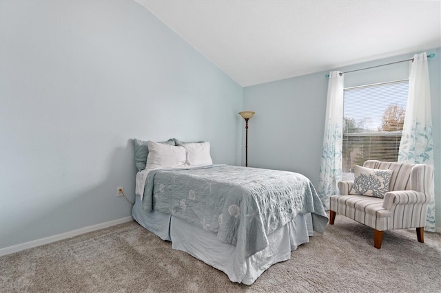 carpeted bedroom with vaulted ceiling