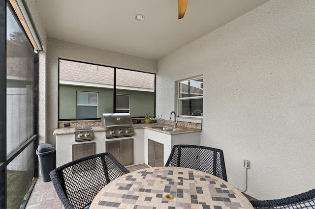 exterior space with ceiling fan and sink