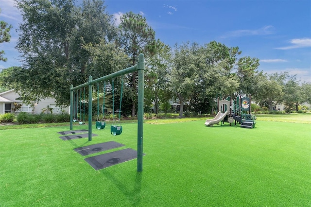 view of home's community featuring a yard and a playground