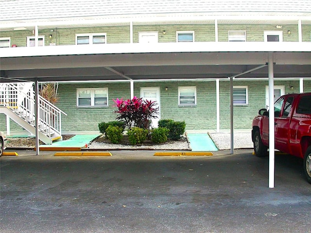 view of parking with a carport