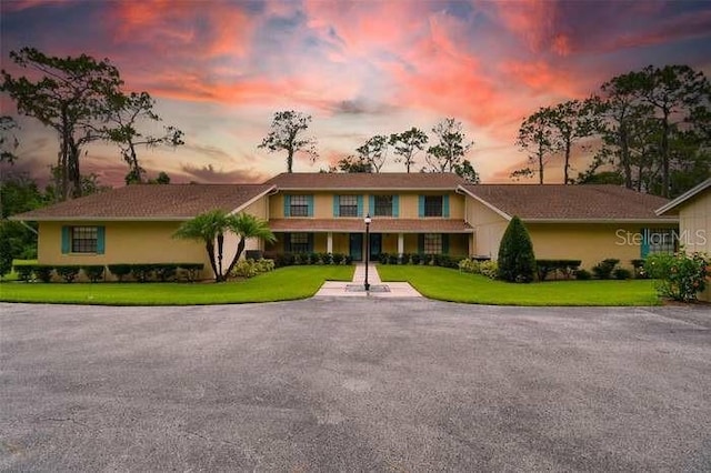 view of front of house with a lawn