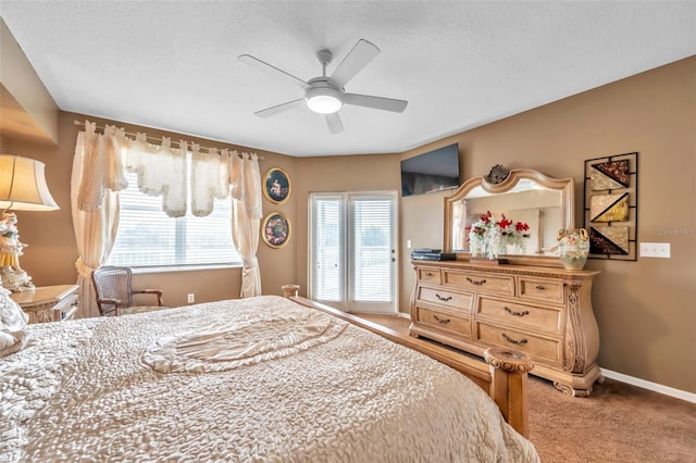 bedroom with light carpet, ceiling fan, a textured ceiling, and baseboards