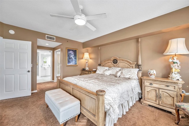 bedroom with light colored carpet, visible vents, and ceiling fan