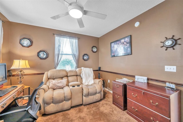 interior space featuring ceiling fan and a textured ceiling