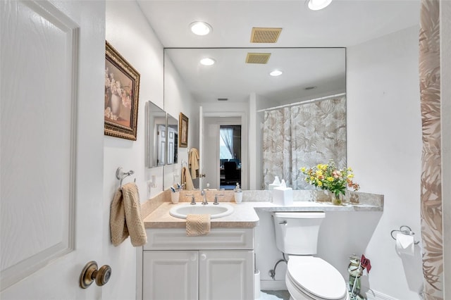 bathroom featuring recessed lighting, visible vents, vanity, and toilet