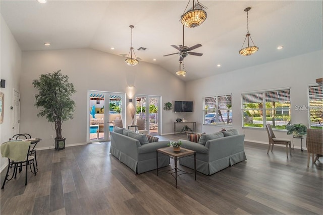 living area featuring dark wood-style floors, french doors, visible vents, high vaulted ceiling, and baseboards