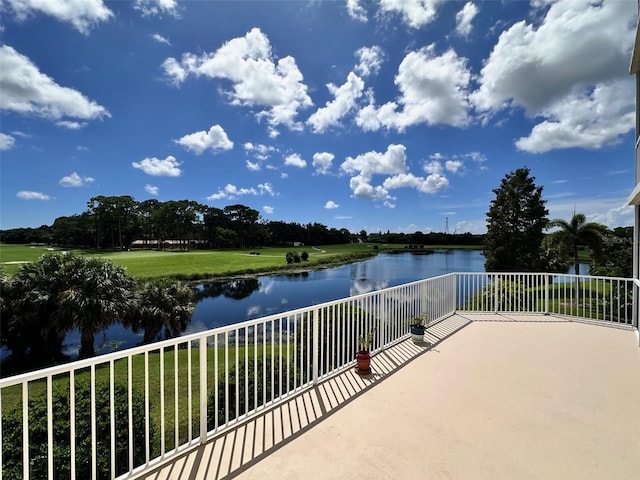 view of patio / terrace featuring a water view and a balcony