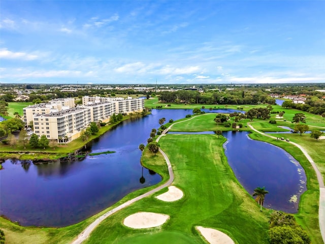 aerial view with a water view, view of golf course, and a view of city