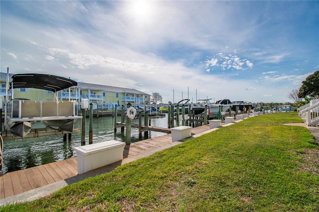 view of dock featuring a yard and a water view