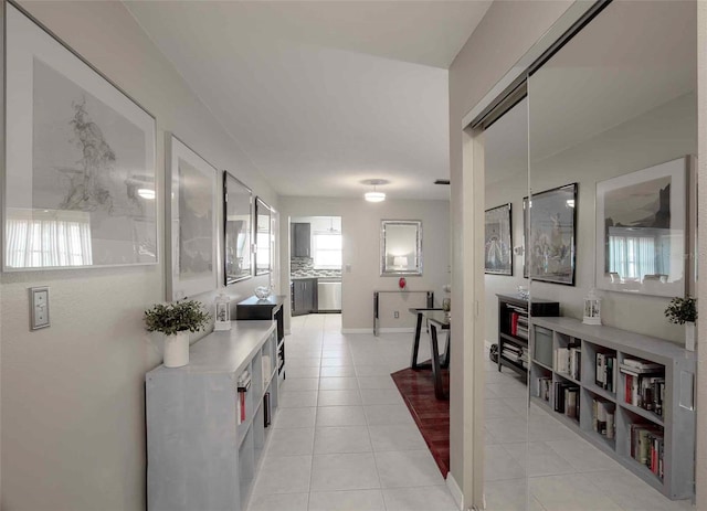 corridor featuring light tile floors