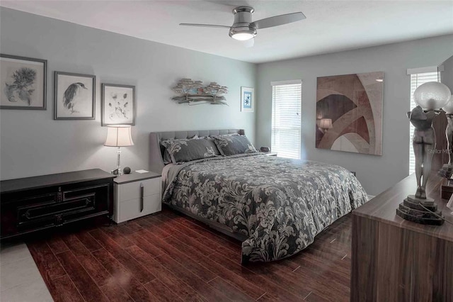 bedroom with ceiling fan and dark wood-type flooring