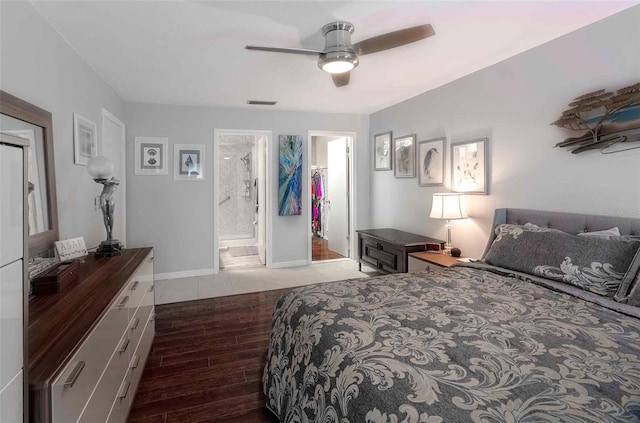 bedroom featuring ensuite bath, ceiling fan, a closet, light hardwood / wood-style flooring, and a spacious closet