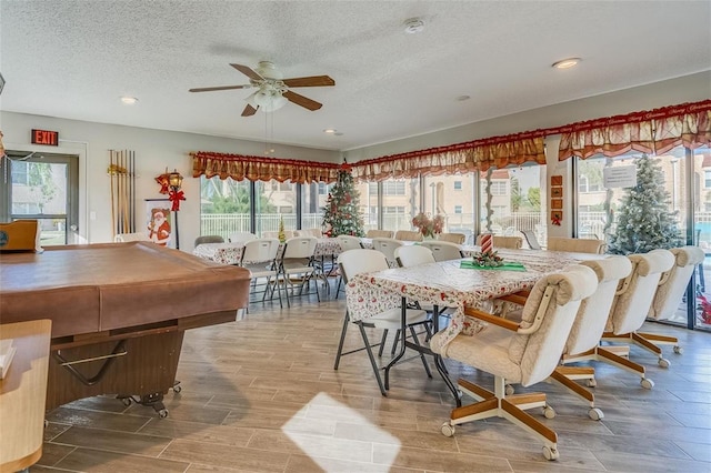 dining space with billiards, a textured ceiling, and ceiling fan