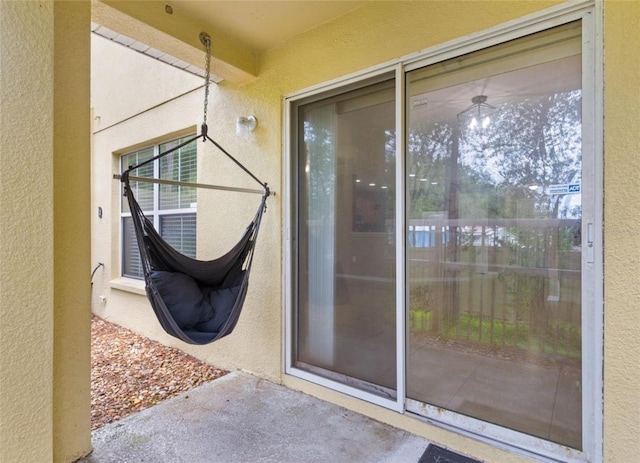 view of exterior entry featuring a patio