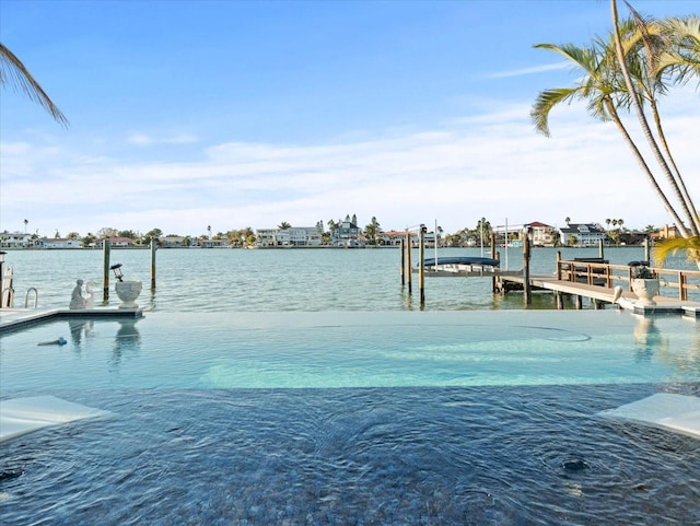 dock area with a water view