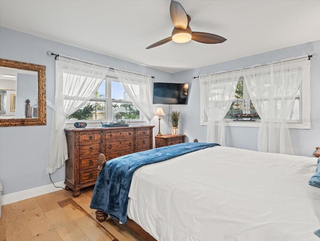 bedroom featuring light hardwood / wood-style floors and ceiling fan