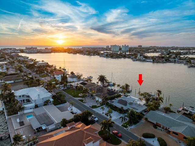 aerial view at dusk with a water view