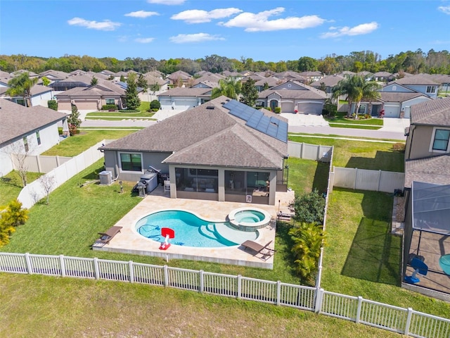 view of pool with a sunroom, a fenced backyard, a residential view, and a patio