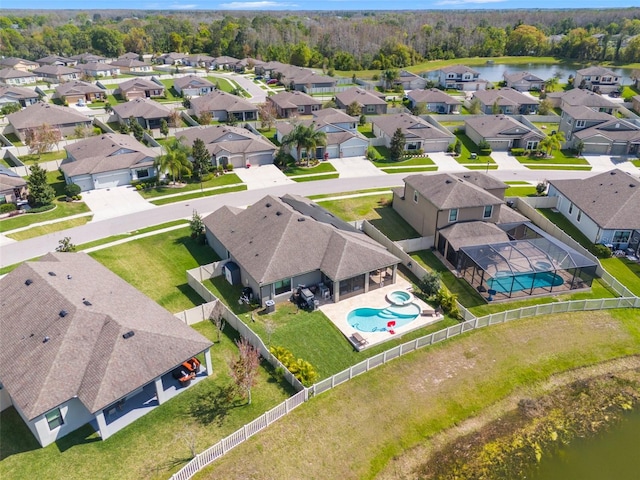 aerial view featuring a residential view and a water view