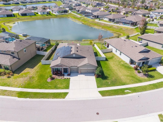 aerial view with a water view and a residential view