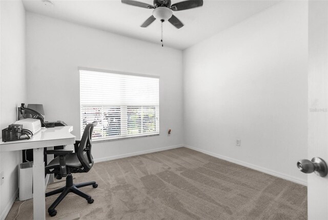 office with carpet, baseboards, and ceiling fan