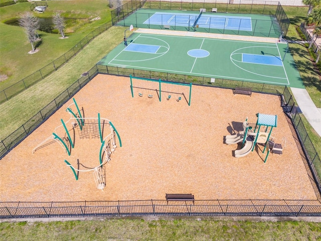 view of sport court featuring community basketball court, playground community, and fence