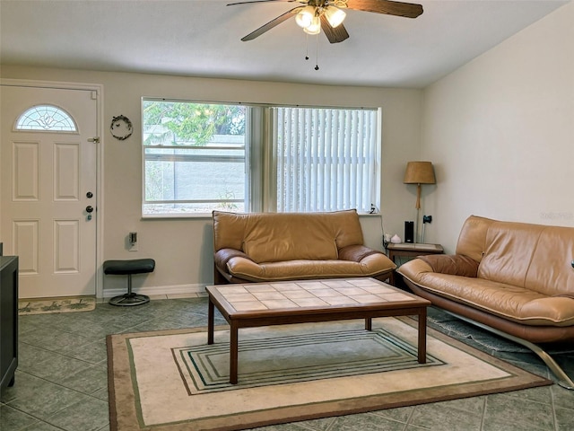 living room featuring tile floors and ceiling fan