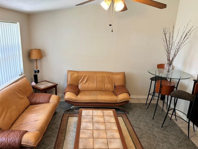 tiled living room with ceiling fan