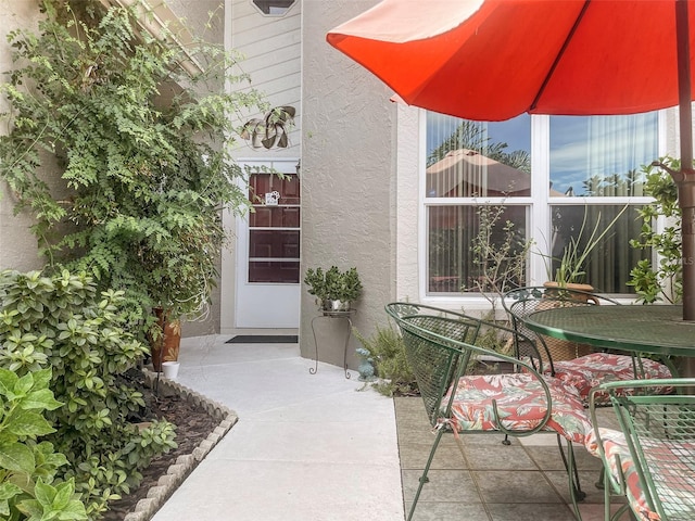 doorway to property featuring a patio