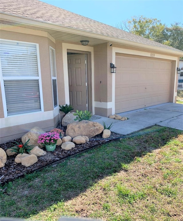 doorway to property featuring a garage