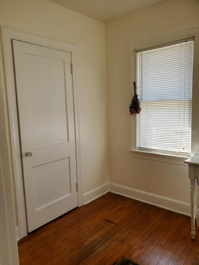 unfurnished room featuring dark hardwood / wood-style floors