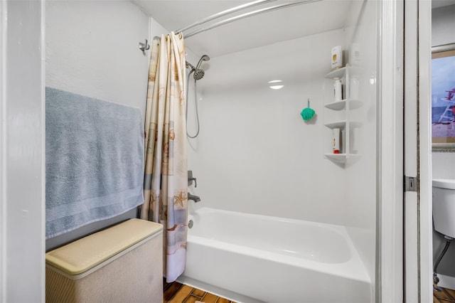 bathroom with shower / bath combination with curtain and hardwood / wood-style floors